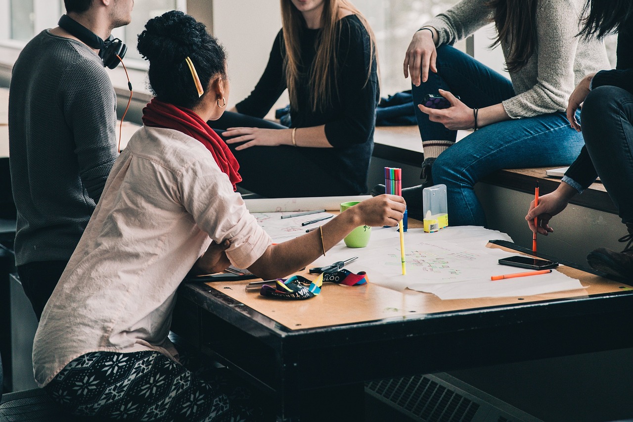 Group of people working around a table